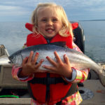 Rebecca Paisley, 4, holding her first salmon, caught on Lake Superior.