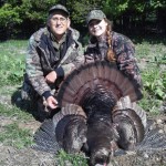 Chloe Harrison with her mentor Rich Henry and a great tom " It was quite a while before the photo could be taken, waiting for Chloe to stop shaking with excitement. 20 lb bird, 8 inch beard and three quarter inch spurs."