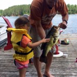 Gia Dodich, 3, was fishing with her Dora rod when this largemouth grabbed a hold of the rock bass on the end of her line