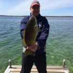 Gord Beaton of Waterloo with this nice smallmouth off the dock on Lake Couchiching.