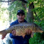 Jason Clayfield with his biggest and "ugliest" carp yet!