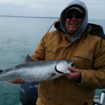 Jamie Grover with his first Chinook salmon downrigging on Lake Huron.