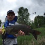 10-year-old Everett with his bass caught on Round Lake.