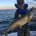 James Nocente, 8, with a beauty walleye he landed while out trolling Lake Erie.