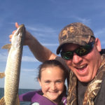 Nick and Brooke Lefaive of Belle River with her first northern pike caught on Lake St. Clair.