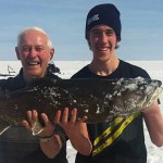 Riley Young with his 20-pound lake trout that he caught on Lake Simcoe.