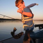 Fishing for bass on Lake Restoule near Horseshoe Island. Ryan, 7, is an excellent caster and loves to fish!