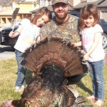 Harvested this 22lb Tom on the May 2nd weekend in the Peterborough, Area Twins, Kenley and Ellyot Wood pose with their Dad while holding Mom's mothers day present, a turkey dinner!