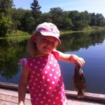 Alena Minten, 4, lands her first fish using a worm and bobber at Pinery Provincial Park
