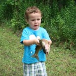 Troy Nevin,3, and his first fish (taken in the summer of 2013).