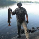 Jason Bobbitt says he used tips from Ontario OUT of DOORS magazine to land this northern pike from shore in the backcountry on Noganosh Lake.