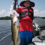 Liam Miller, 10, scores a 20" walleye on Lake Esnagi