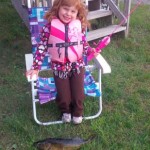 Mckenzie, 4, used her pink Barbie pole with a bobber and worm catch her very first walleye. She did it all on her own and Daddy helped net it.
