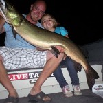 Five-year-old Eden Nelson and Rich Nelson with Eden's first muskie. Caught near North Bay.