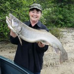 Wayne Hansen of Marathon submitted this photo of his wife Deb. While fishing for Walleye in 20 feet of water, a 35" lake trout bit Deb's yellow jig. “Not sure which is bigger… the lake trout or Deb’s smile?”
