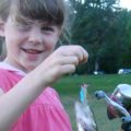 girl holding a fish