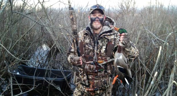 Mike Beale - a guy holding a mallard drake