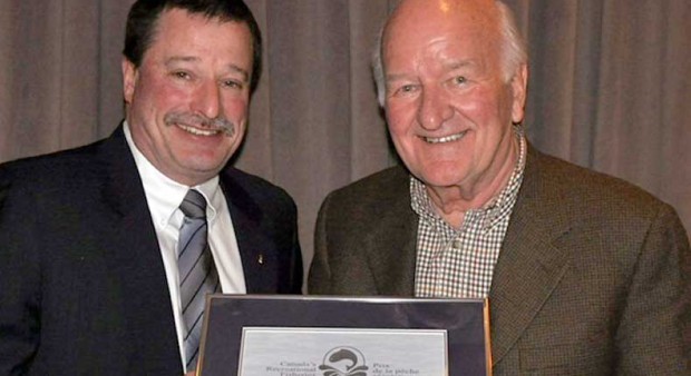 Fisheries and Oceans Canada Regional Director General Dave Burden (left) presents Walter Oster with a 2013 Recreational Fisheries Award.