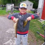 Aidan B. with his first ever walleye caught while pan fishing