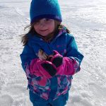 Aubrey Begin caught her first fish, a 7-inch perch, while out on the ice with her dad Bob.