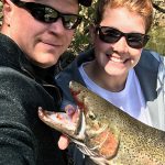 Darrin Parfit and Nicole Lange with a rainbow trout in Bowmanville.