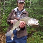 Cherie Duffield displays her first walleye of the season, caught on Lake Abitibi.