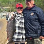 Jim Hughes of Maynooth with a trout caught on Lake Nipigon with grandson Javin Hughes.
