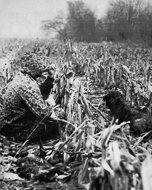 duck hunter in a field.