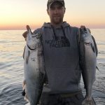 Calvin Pitt of Sault Ste. Marie shows why it was a perfect evening to chase kings (Chinook salmon) on Lake Superior near his hometown.
