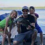 Sean Porter is flanked by Mackenzie and Emily Porter while bass fishing at Grandma’s house on Lake Duborne in Blind River.