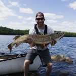 In catching this giant northern pike in Quetico Provincial Park, Matt Gutpell of Fort Frances completed the Quetico Grand Slam – landing all four species (lake trout, northern, walleye, and bass) that can be caught on one lake. He caught each on a homemade trolling spoon before releasing them.