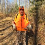 Dave Anderson of Hamilton with two ruffed grouse harvested with his dad.