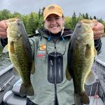 Emily Enns of Kenora holds up largemouth bass caught in Sioux Narrows.