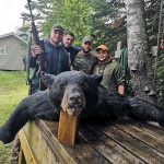 Paolo Caprara of Toronto, Giancarlo Caprara, Daniel Toigo, Vinny Sinopoli, and Max the dog with a bear harvested at Lower Twin Lakes Lodge during this year’s hunt – Daniel’s first bear hunt.