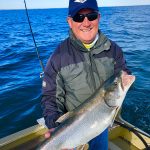 Duncan Macaulay sent in this photo of his dad Dan posing with one of many lake trout they caught and released while trolling on Lake Erie. “The bite was on and so were our smiles,” he wrote.