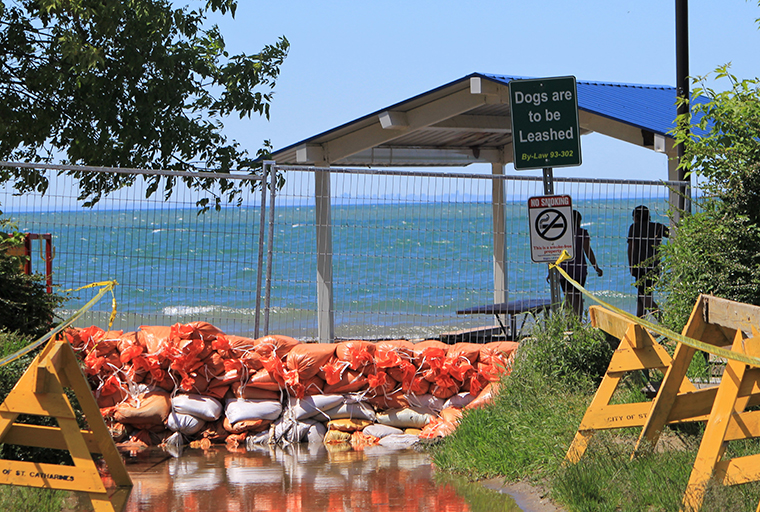 Sandbags holding back rising water on Lake Ontario