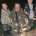 Mime Lint of Selkirk harvested this big buck before getting photos with sons Brayden and Brody.