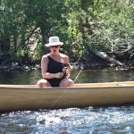 Francine D Batog of Geraldton lands a walleye in the Steel River.
