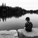 Brady Kuehl’s six year-old-son, Wesley, waits for fish in the town of New Dundee last summer.