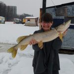 Ron Kaine of Orléans took this memento of wife Alexis’ first through-the-ice-pike before returning it to the water.