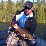 Ryan Brown of Port Elgin now reminisces about catching this 26-inch brookie on his annual fishing trip.