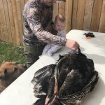 James Macmullin of Guelph shares his first turkey harvest with wee son Ian, before processing.