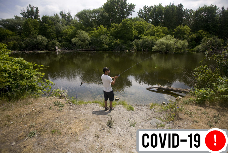 A man fishes on a river