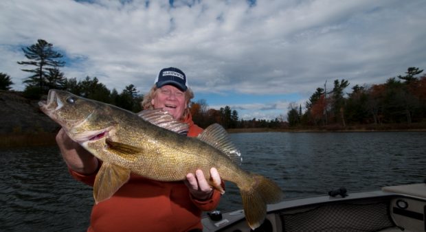 Angler holding a walleye