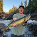 Justin Loring of Cochrane harvested this walleye on a jighead and twister tail after a hard portage into a northern river near Cochrane.