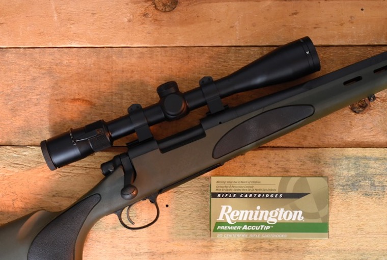 a Remington firearm with a box of ammo