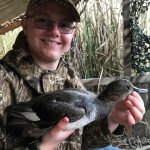 John Lockwood of Kingston and son, Wesley, shared a moment with a  Gadwall harvested on the Rideau Canal in the blind behind their home.