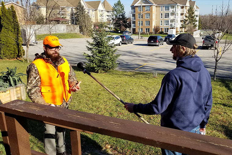 hunter being interviewed by a man holding a microphone