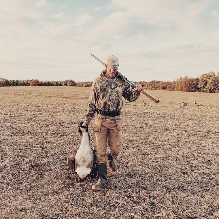 Matt Morson moved forward across a field, holding a Canada goose by the neck in one hand, a firearm across his shoulder in the other