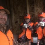 Patrick Wylie of Lanark and his girls, Hannah and Margot, enjoy some hot chocolate in the “deer fort” within the Lanark Highlands of the 2020 rifle season.